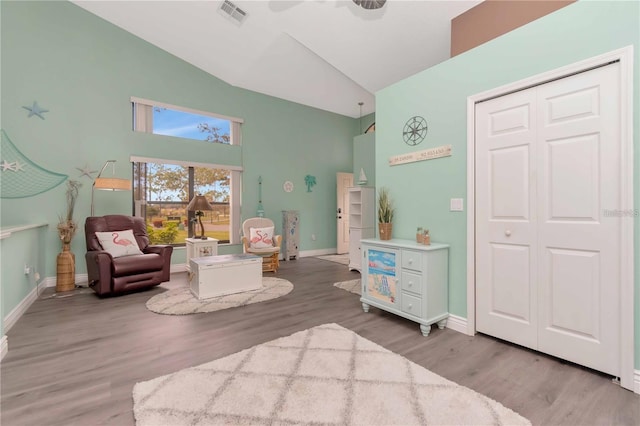 9626 Woodhollow Ct, New Port Richey, FL 34655 - living area featuring high vaulted ceiling and wood finished floors