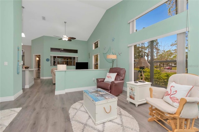 9626 Woodhollow Ct, New Port Richey, FL 34655 - living room featuring high vaulted ceiling, ceiling fan, and wood finished floors