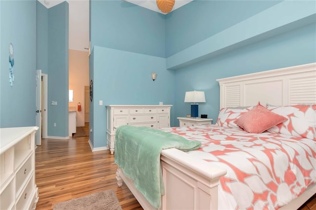 9626 Woodhollow Ct, New Port Richey, FL 34655 - bedroom featuring a high ceiling and light wood-style floors