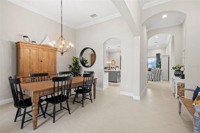 13208 Fawn Lily Dr, Riverview, FL 33579 - dining room with a chandelier, arched walkways, ornamental molding, light tile patterned floors, and recessed lighting