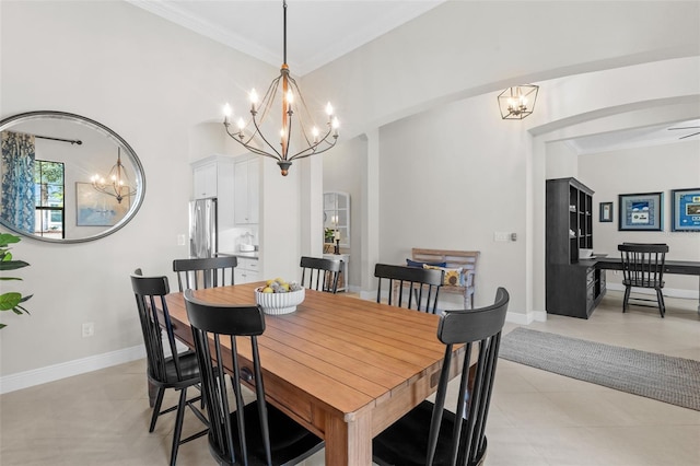 13208 Fawn Lily Dr, Riverview, FL 33579 - dining room with a chandelier, crown molding, light tile patterned floors, and arched walkways