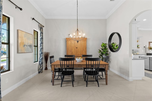 13208 Fawn Lily Dr, Riverview, FL 33579 - dining room with ornamental molding, arched walkways, a chandelier, and light tile patterned floors