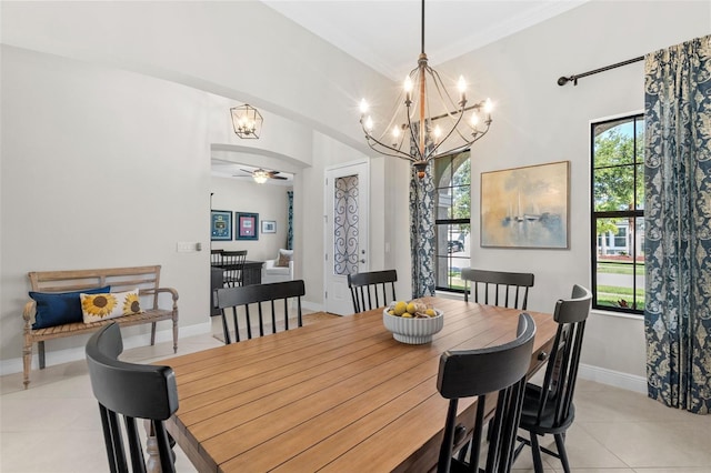 13208 Fawn Lily Dr, Riverview, FL 33579 - dining area with a chandelier, light tile patterned floors, plenty of natural light, ceiling fan, and ornamental molding