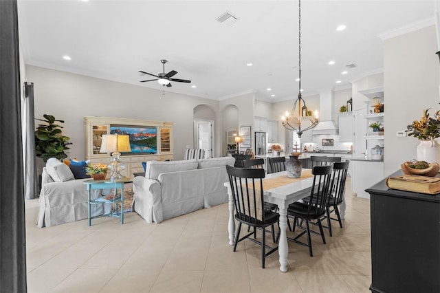 13208 Fawn Lily Dr, Riverview, FL 33579 - dining room featuring a chandelier, arched walkways, ceiling fan, recessed lighting, and ornamental molding