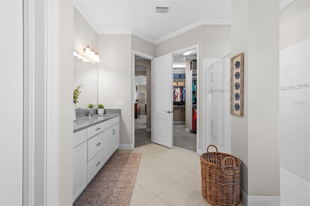 13208 Fawn Lily Dr, Riverview, FL 33579 - full bath featuring vanity, walk in shower, ornamental molding, tile patterned floors, and a walk in closet