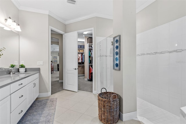 13208 Fawn Lily Dr, Riverview, FL 33579 - full bathroom with vanity, a walk in shower, tile patterned floors, a spacious closet, and crown molding