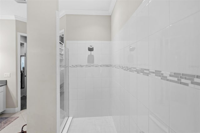 13208 Fawn Lily Dr, Riverview, FL 33579 - bathroom with tiled shower, crown molding, vanity, and tile patterned floors