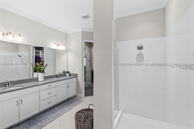 13208 Fawn Lily Dr, Riverview, FL 33579 - full bathroom featuring a tile shower, double vanity, a spacious closet, crown molding, and tile patterned floors