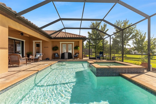 13208 Fawn Lily Dr, Riverview, FL 33579 - view of swimming pool with french doors, a patio, a pool with connected hot tub, and glass enclosure