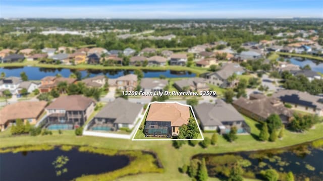 13208 Fawn Lily Dr, Riverview, FL 33579 - aerial perspective of suburban area with property boundaries highlighted and a nearby body of water