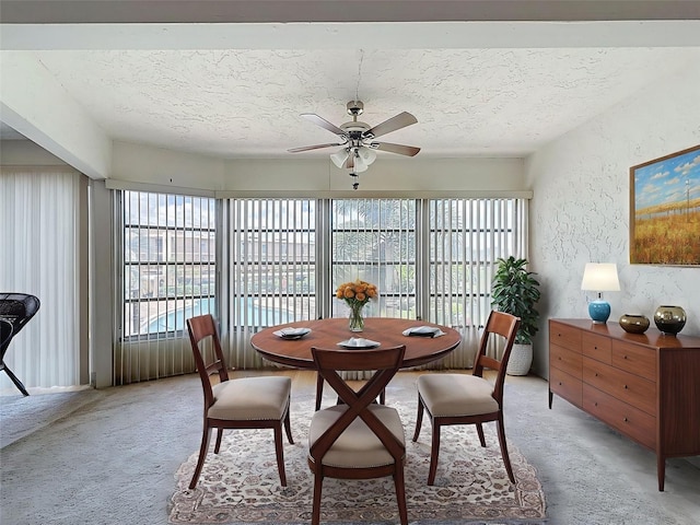 225 Country Club Dr Unit A203, Largo, FL 33771 - dining room with plenty of natural light, ceiling fan, light carpet, and a textured ceiling