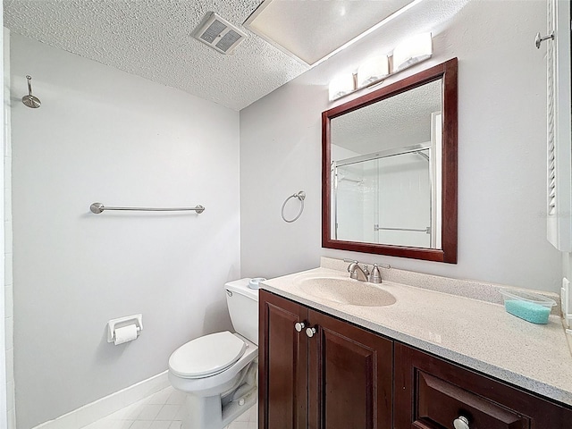225 Country Club Dr Unit A203, Largo, FL 33771 - bathroom with vanity, a textured ceiling, a shower with door, and tile patterned floors