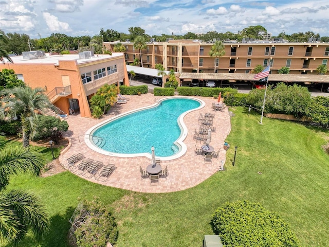 225 Country Club Dr Unit A203, Largo, FL 33771 - community pool with a yard and a patio