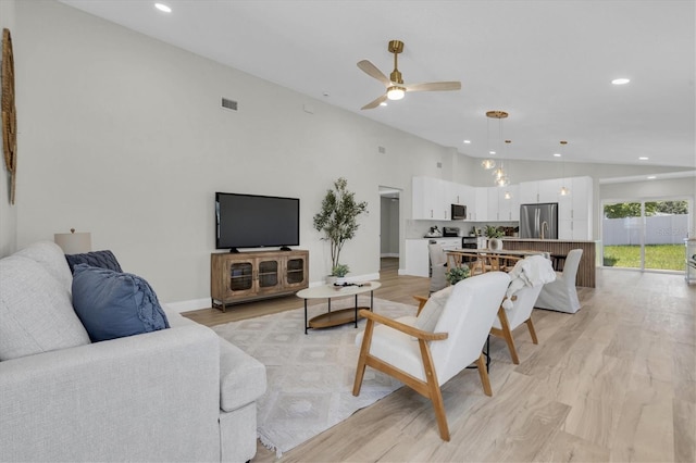 6529 Taylor Ct, New Port Richey, FL 34653 - living area featuring a ceiling fan, recessed lighting, light wood-type flooring, and high vaulted ceiling