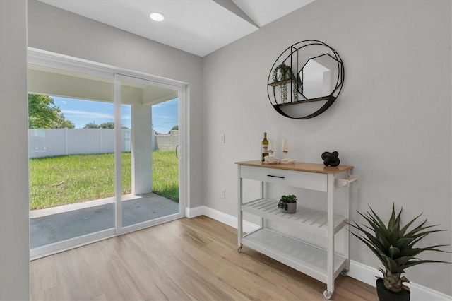 6529 Taylor Ct, New Port Richey, FL 34653 - entryway featuring baseboards and wood finished floors