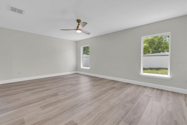 6529 Taylor Ct, New Port Richey, FL 34653 - spare room with light wood-type flooring and a ceiling fan