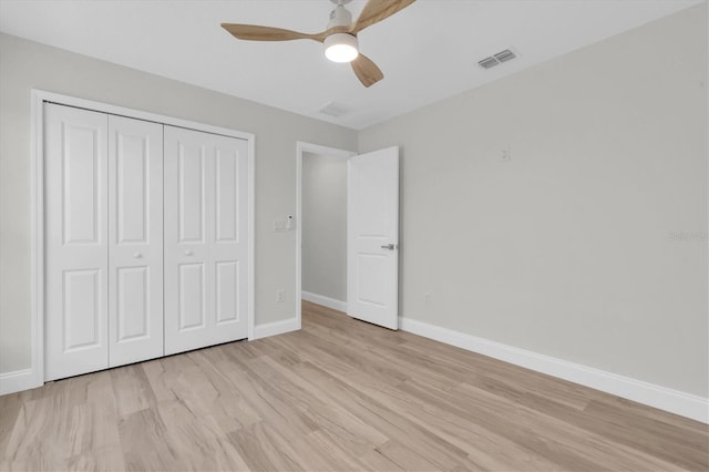 6529 Taylor Ct, New Port Richey, FL 34653 - unfurnished bedroom featuring a closet, light wood-style flooring, and ceiling fan