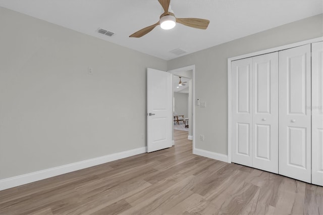 6529 Taylor Ct, New Port Richey, FL 34653 - unfurnished bedroom featuring light wood-type flooring, a closet, and a ceiling fan