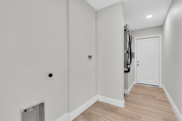 6529 Taylor Ct, New Port Richey, FL 34653 - corridor with light wood-style floors and baseboards