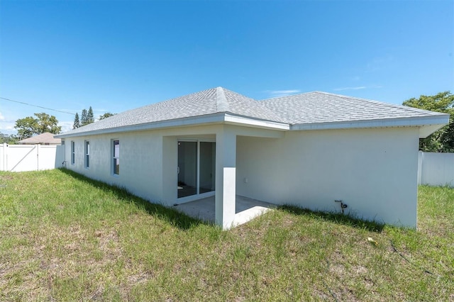 6529 Taylor Ct, New Port Richey, FL 34653 - back of house with stucco siding, a patio, and roof with shingles