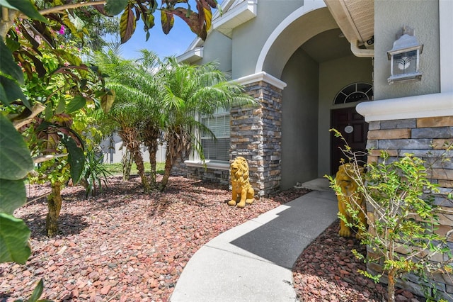 11126 Biddeford Pl, New Port Richey, FL 34654 - entrance to property featuring stucco siding and stone siding