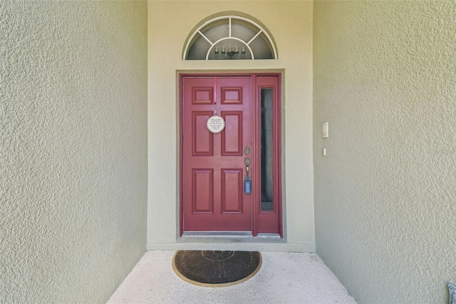 11126 Biddeford Pl, New Port Richey, FL 34654 - view of exterior entry with stucco siding