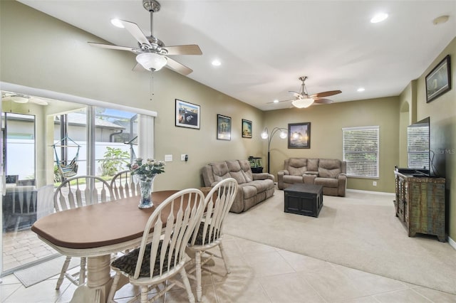 11126 Biddeford Pl, New Port Richey, FL 34654 - dining area with a ceiling fan, light carpet, recessed lighting, healthy amount of natural light, and light tile patterned floors