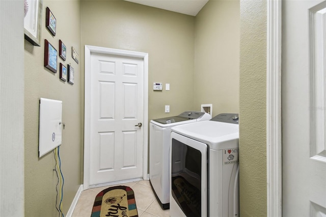 11126 Biddeford Pl, New Port Richey, FL 34654 - washroom with independent washer and dryer and light tile patterned flooring
