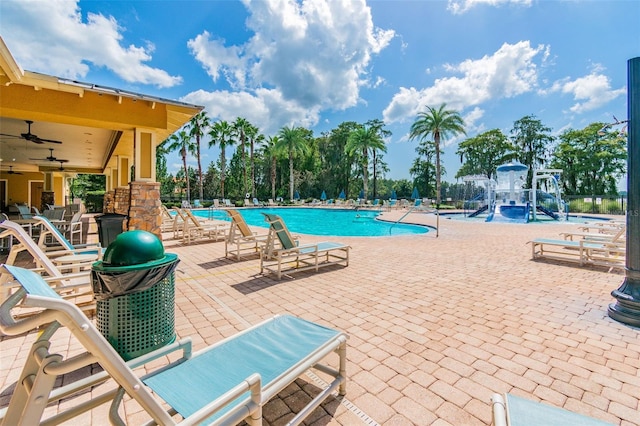 11126 Biddeford Pl, New Port Richey, FL 34654 - community pool featuring a patio area and a ceiling fan