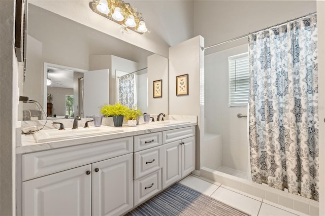 bathroom with curtained shower, double vanity, tile patterned flooring, and plenty of natural light