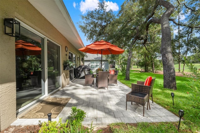 view of patio with outdoor dining area