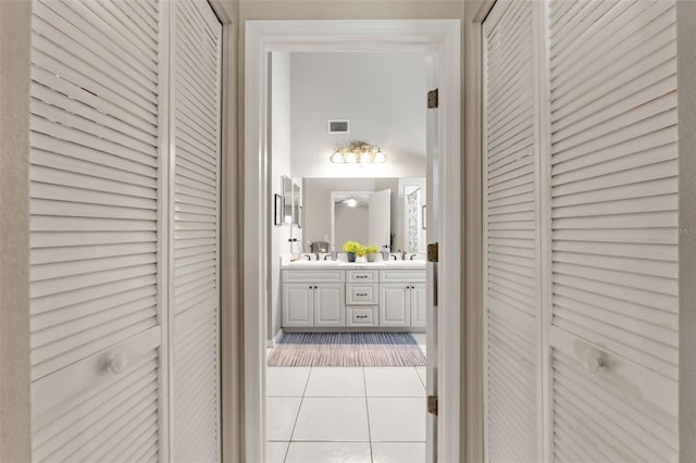 hall with light tile patterned flooring