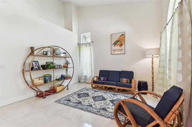 1120 Bluffs Cir, Dunedin, FL 34698 - sitting room with a towering ceiling and baseboards