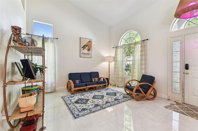 1120 Bluffs Cir, Dunedin, FL 34698 - foyer featuring tile patterned flooring and high vaulted ceiling