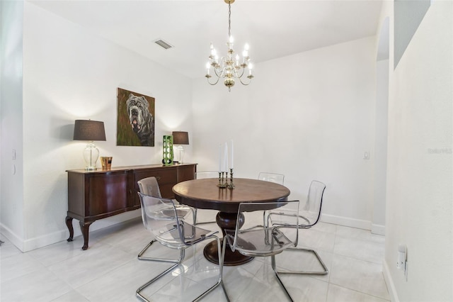 1120 Bluffs Cir, Dunedin, FL 34698 - dining area with a chandelier and light tile patterned floors