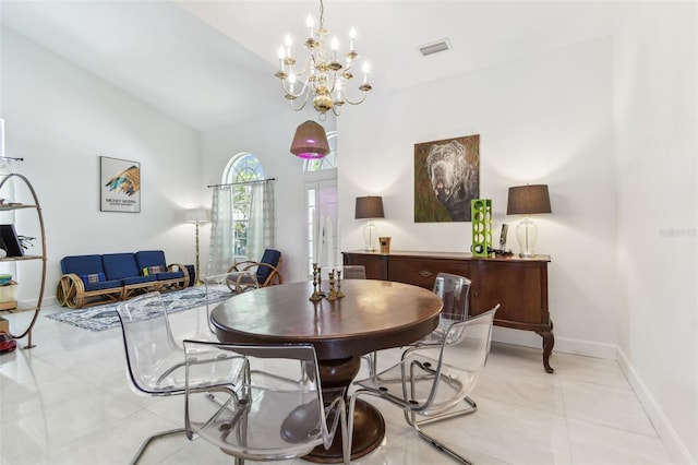 1120 Bluffs Cir, Dunedin, FL 34698 - dining room with light tile patterned floors, a chandelier, and high vaulted ceiling