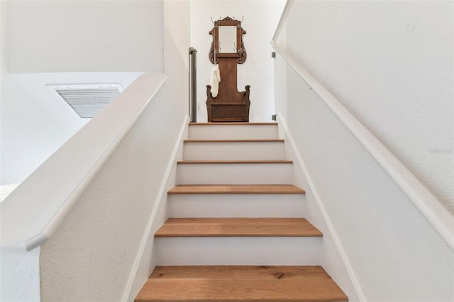 1120 Bluffs Cir, Dunedin, FL 34698 - stairway featuring wood finished floors