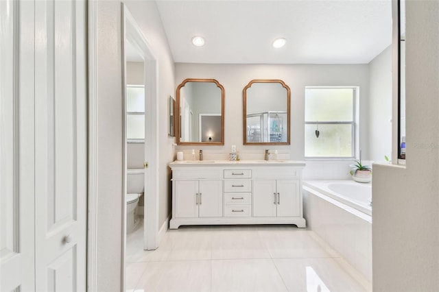 1120 Bluffs Cir, Dunedin, FL 34698 - full bath featuring tile patterned flooring, double vanity, a bath, and recessed lighting