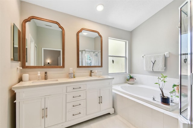 1120 Bluffs Cir, Dunedin, FL 34698 - bathroom featuring a shower stall, double vanity, and a bath