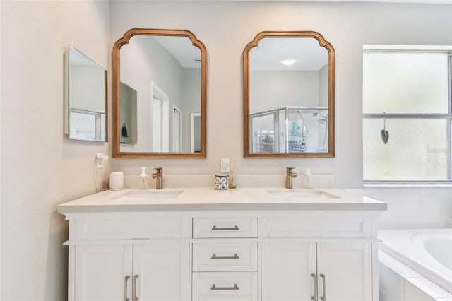 1120 Bluffs Cir, Dunedin, FL 34698 - bathroom with a bath, double vanity, and a shower with shower door