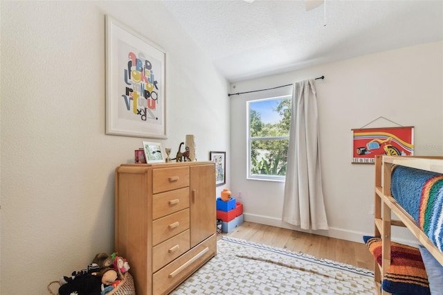 1120 Bluffs Cir, Dunedin, FL 34698 - bedroom featuring light wood-type flooring and baseboards