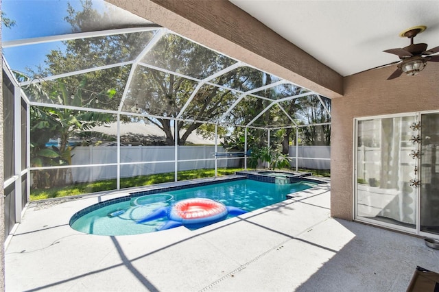 1120 Bluffs Cir, Dunedin, FL 34698 - view of pool featuring a pool with connected hot tub, a patio, a fenced backyard, a ceiling fan, and glass enclosure