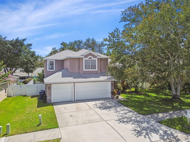 1120 Bluffs Cir, Dunedin, FL 34698 - traditional-style house featuring stucco siding, a garage, a gate, and driveway