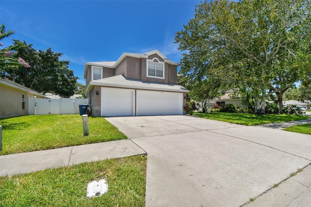 1120 Bluffs Cir, Dunedin, FL 34698 - traditional-style home with driveway, stucco siding, an attached garage, and a gate