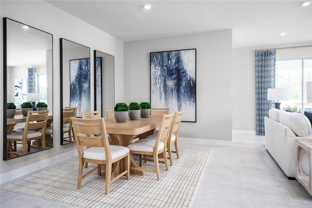 118 Venetian Palms Blvd, New Smyrna Beach, FL 32168 - dining space featuring plenty of natural light, a textured ceiling, recessed lighting, and light tile patterned floors