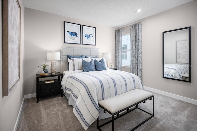 118 Venetian Palms Blvd, New Smyrna Beach, FL 32168 - carpeted bedroom featuring a textured ceiling and baseboards