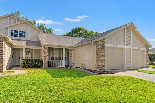 6519 Thicket Trl, New Port Richey, FL 34653 - view of front of home featuring brick siding, a front yard, driveway, a garage, and roof with shingles