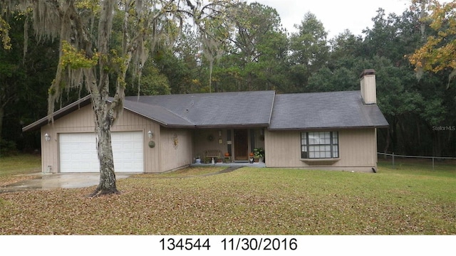 916 Whiteway Dr, Brooksville, FL 34601 - ranch-style home featuring a garage, a chimney, and driveway