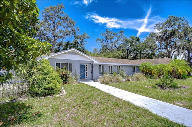 5523 Carlton Rd, New Port Richey, FL 34652 - ranch-style house with a front lawn and stucco siding