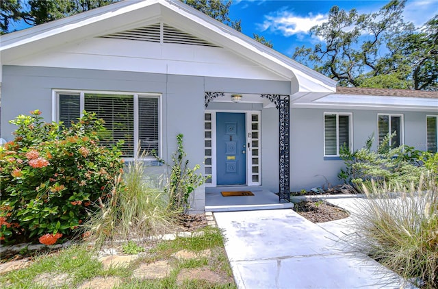 5523 Carlton Rd, New Port Richey, FL 34652 - doorway to property featuring stucco siding